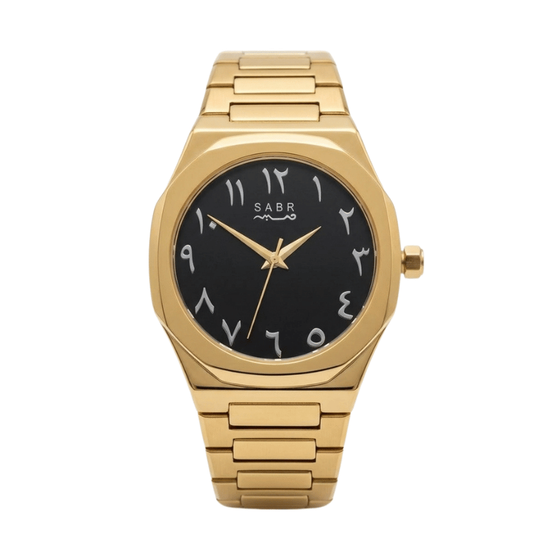 A gold-tone stainless steel wristwatch with a black dial, Arabic numeral hour markers, and a matching gold-tone link bracelet, shown against a plain white background.